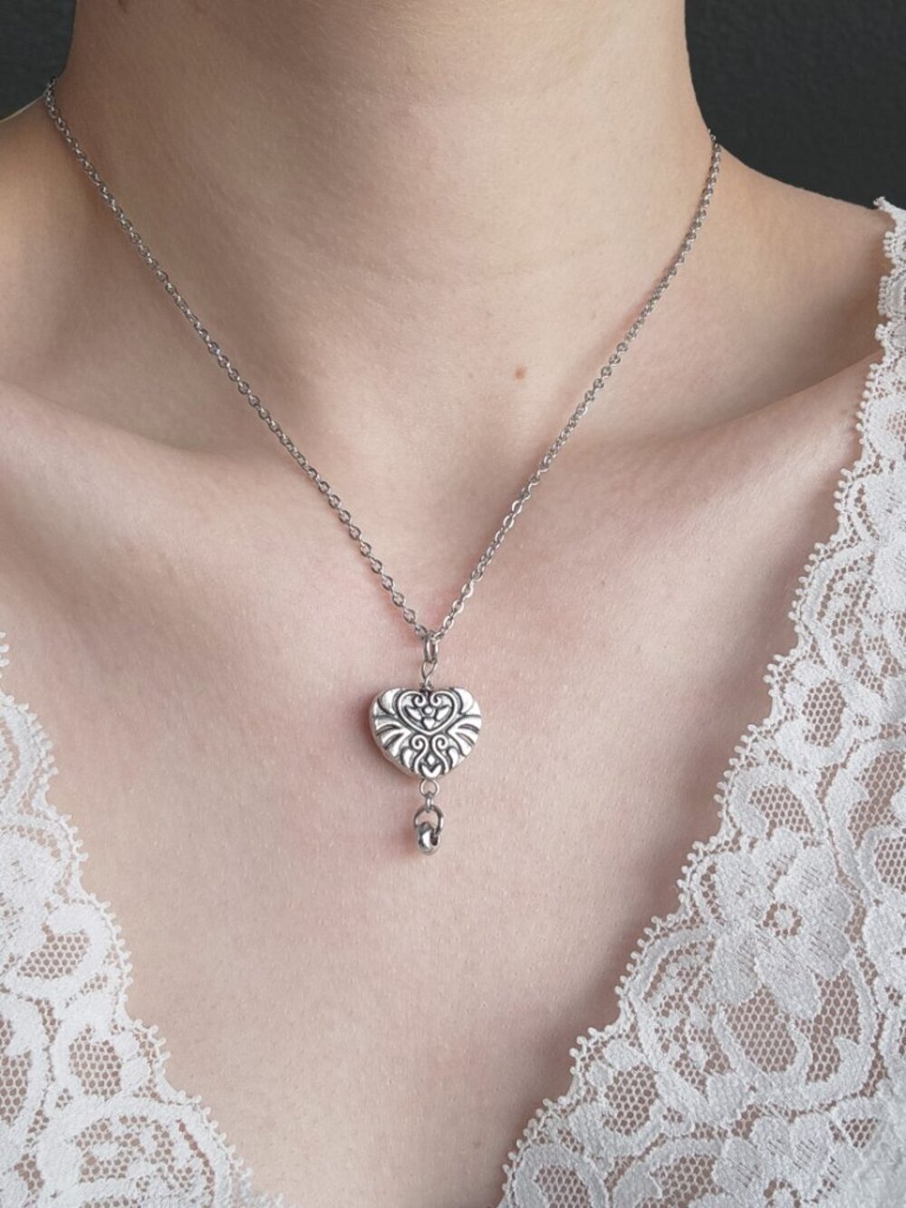 Silver heart necklace with a small silver chain